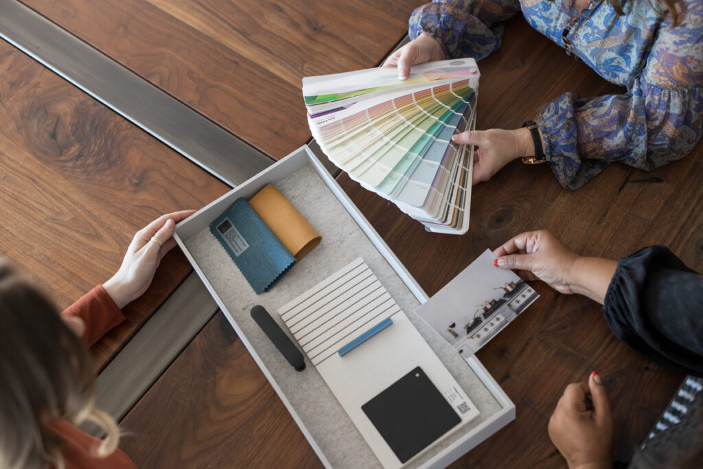 Homeowner having design consultation with interior designer for remodeling project to ensure a smooth home renovation, by ASR Design Studio