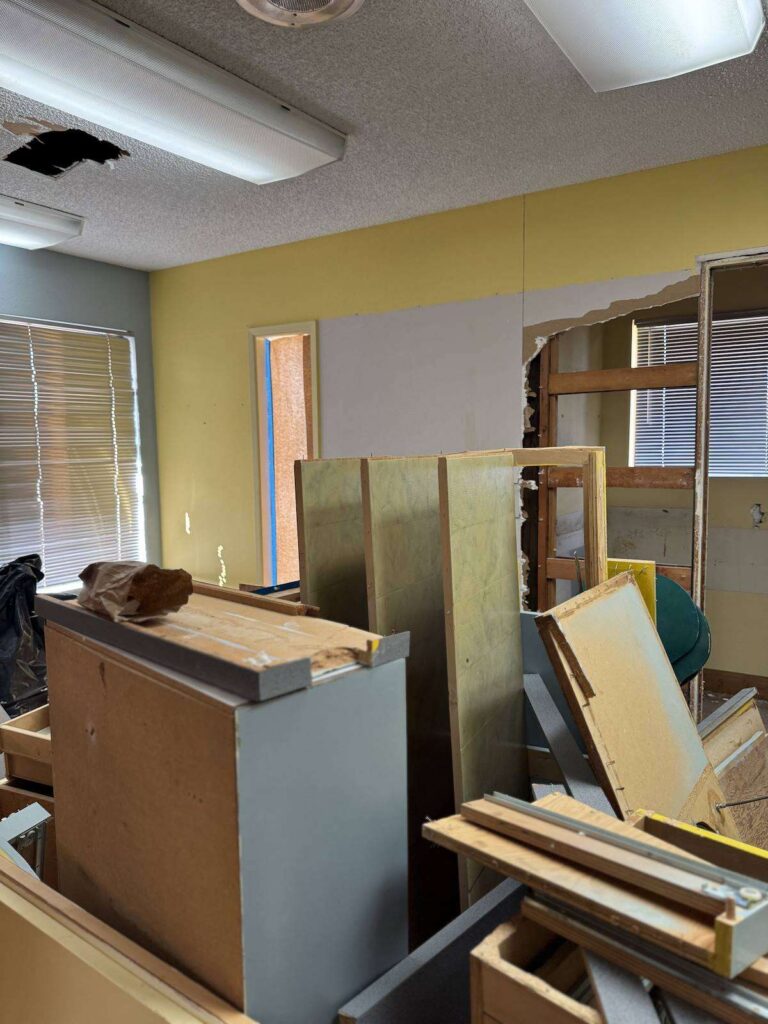 Smiles by Pai during construction: demolition of the original office with old cabinets removed